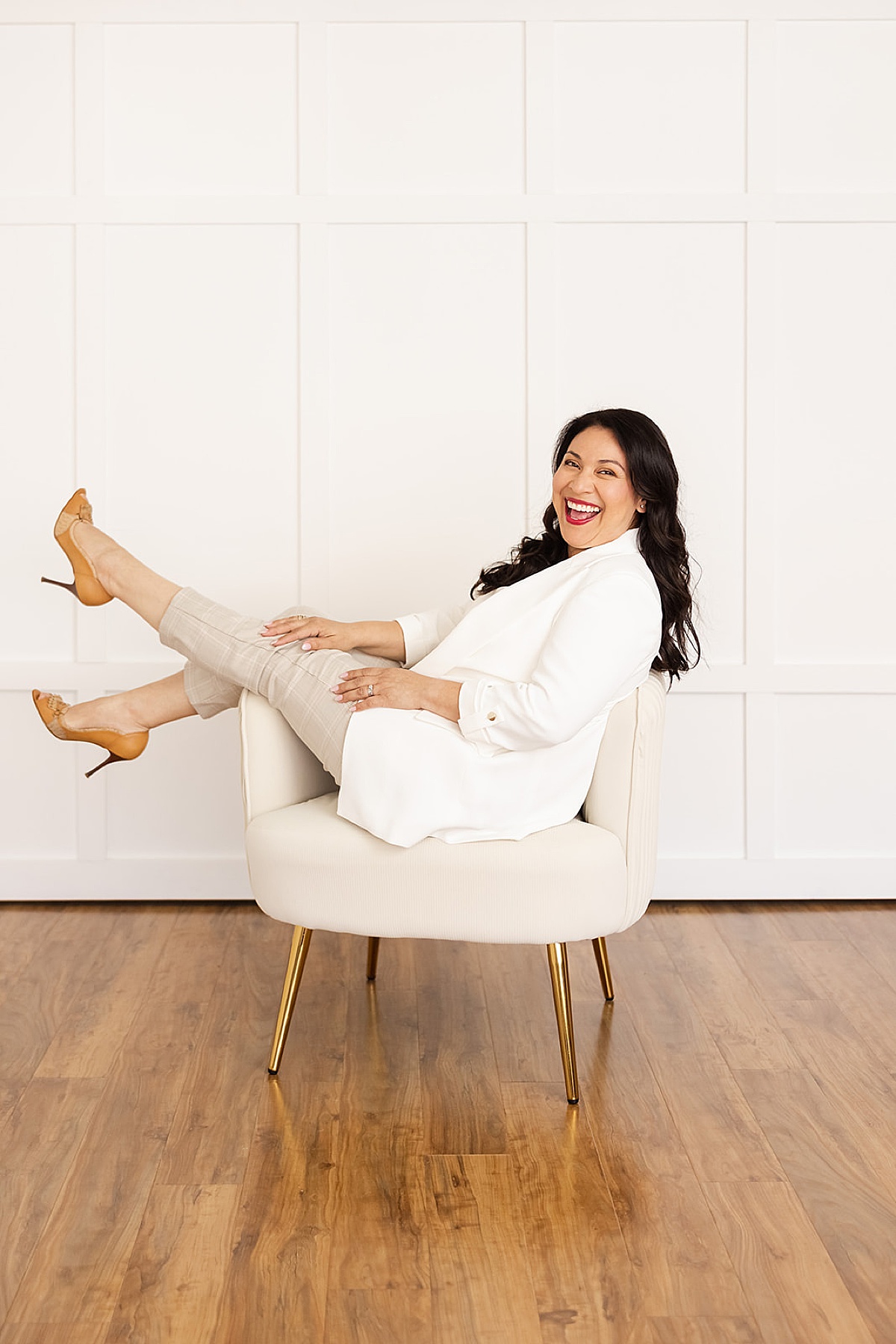 women sitting on chair having fun and smiling for a San Francisco Branding Photographer