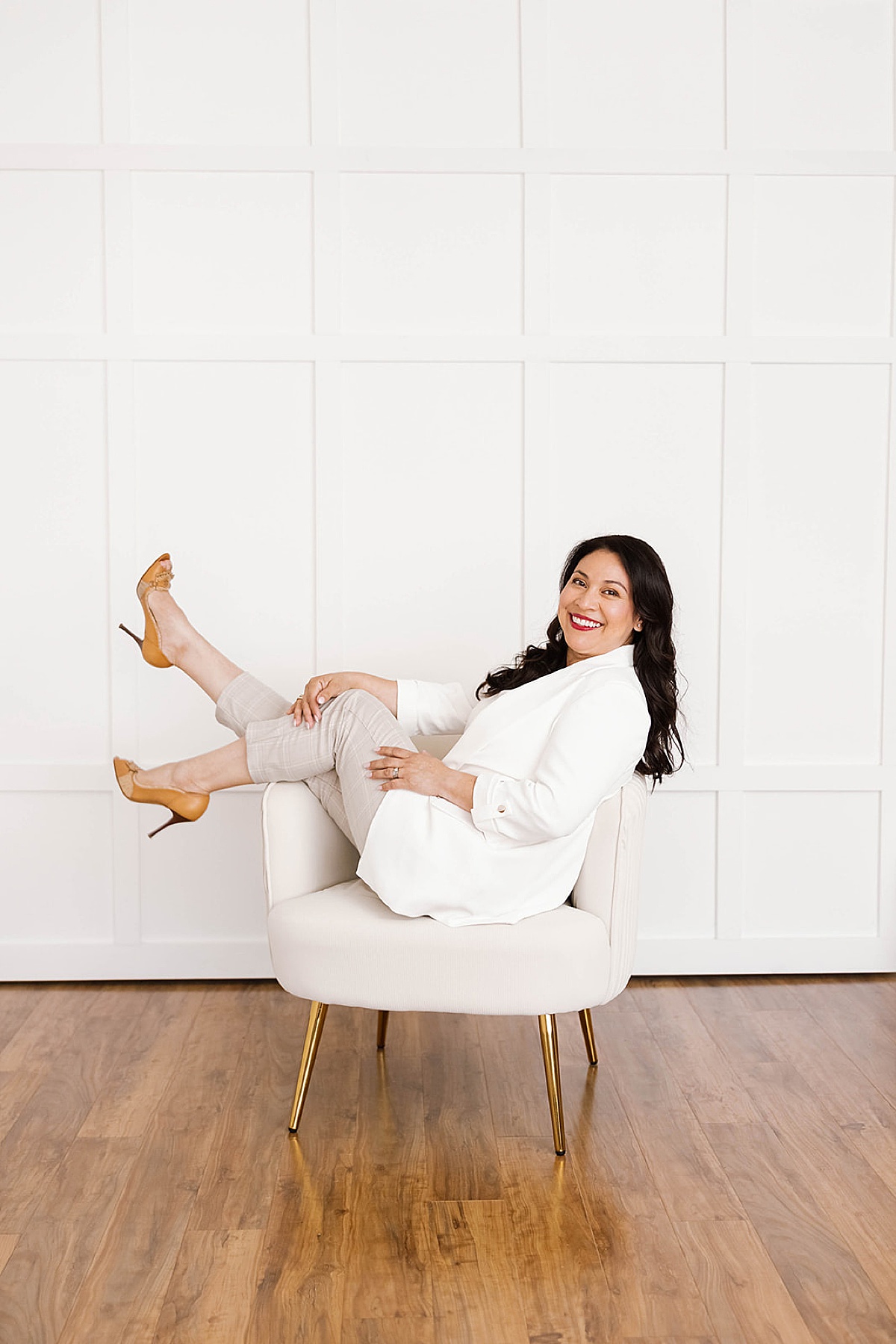 women sitting in chair with her feet up during her brand photo shoots