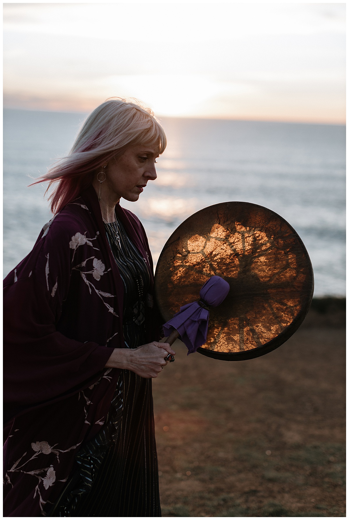 Woman stands in front of the ocean during her Healer Brand Photoshoot 