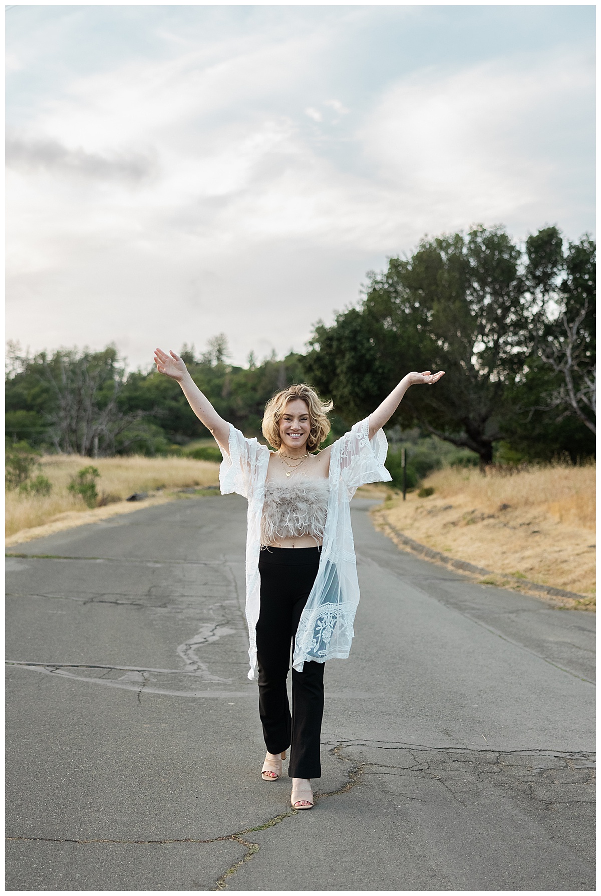 Woman walks in the road during her Healer Brand Photoshoot 