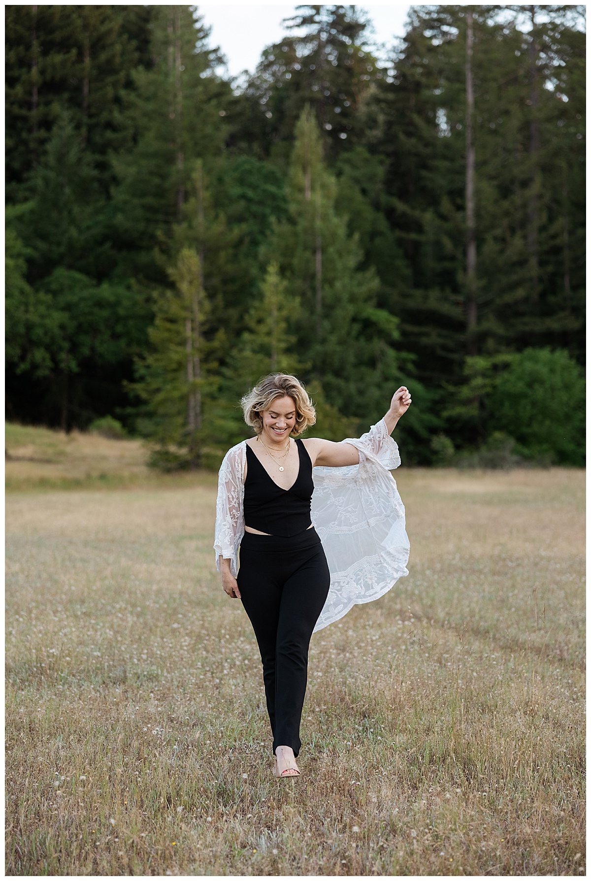 A person walks through the forest during her Healer Brand Photoshoot 