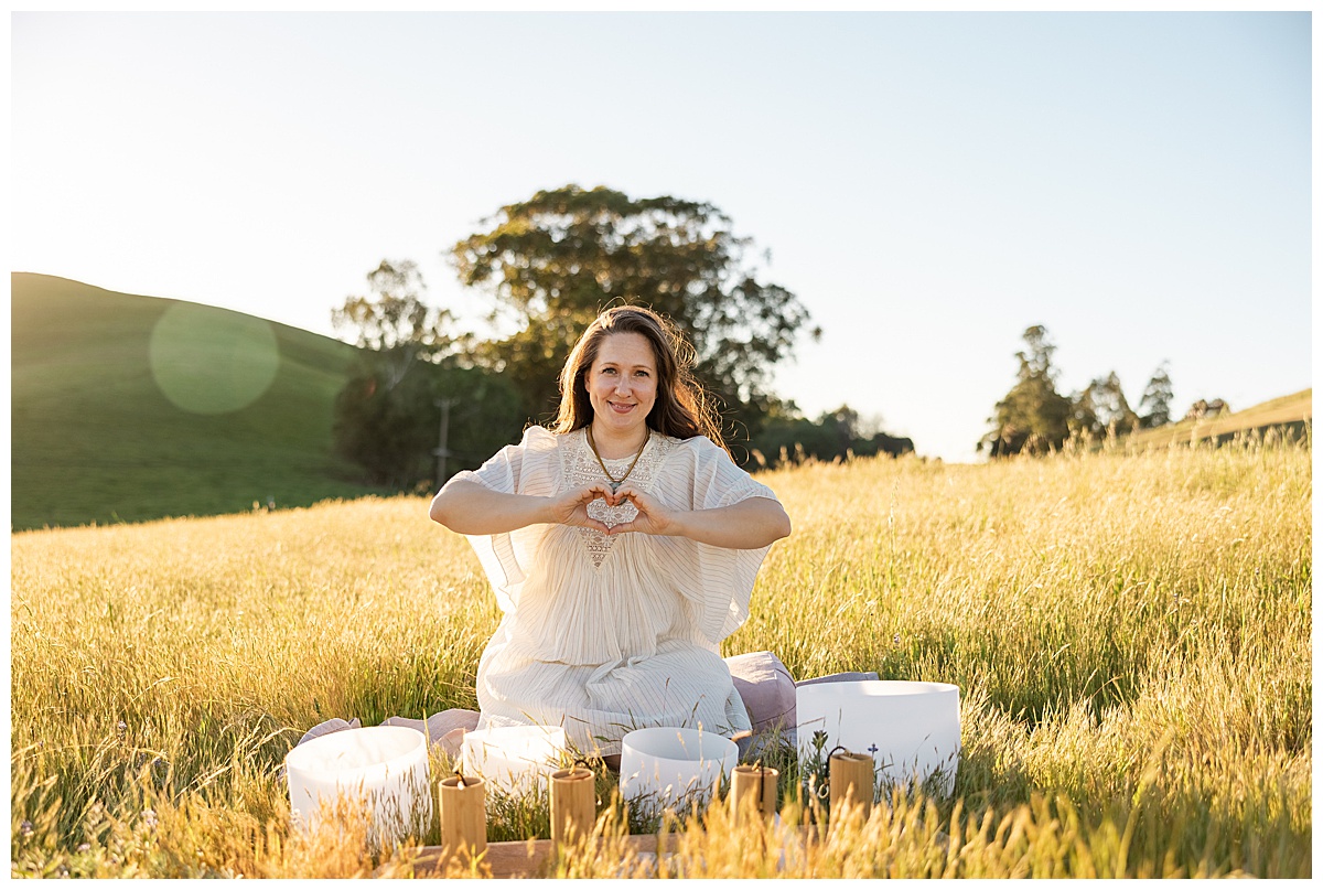 Person sits down in a field for a Brand photographer