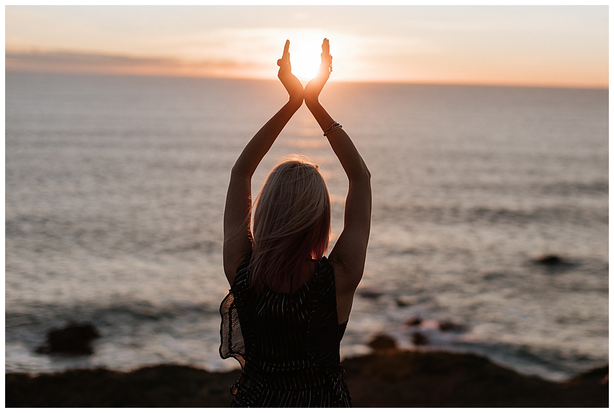 Adult stands by an ocean for Brand photographer